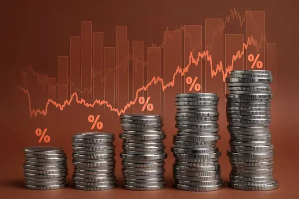Mortgage rate. Stacked coins, graphs and percent signs on brown background