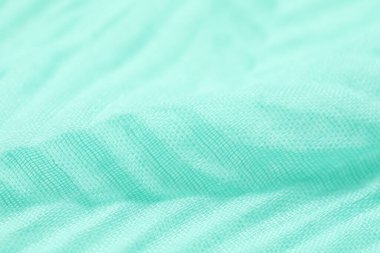 Arkaplan olarak turkuaz kumaşın dokusu, yakın plan