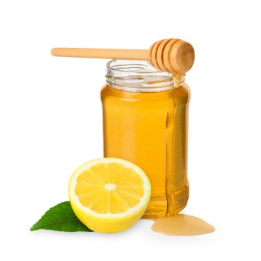 Bal cam kavanozda, limon ve balık beyazda izole edilmiş.