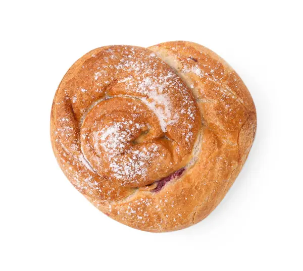 Lezzetli rulo reçelli ve toz şekerli beyaz, üst manzara. Tatlı çörek.