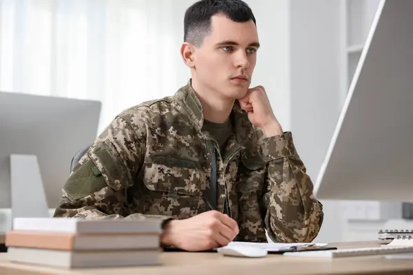 Military education. Young student learning at table indoors