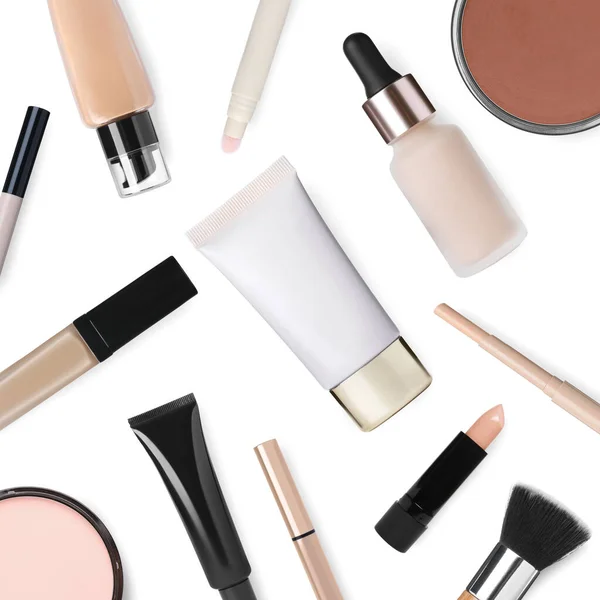 Face powders, concealers, liquid foundations and brush isolated on white. Collection of makeup products