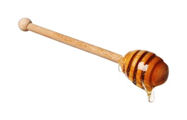 Beyaz arka planda doğal bal damlıyor.