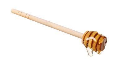 Beyaz arka planda doğal bal damlıyor.