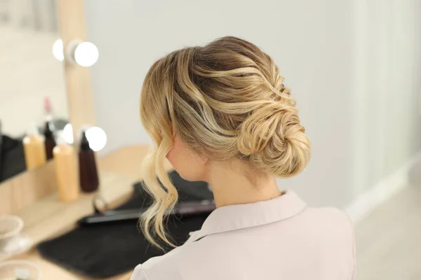 Woman with beautiful hair style in salon