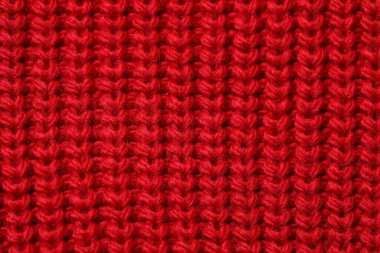 Arka plan olarak yumuşak kırmızı örülmüş kumaş dokusu, üst görünüm