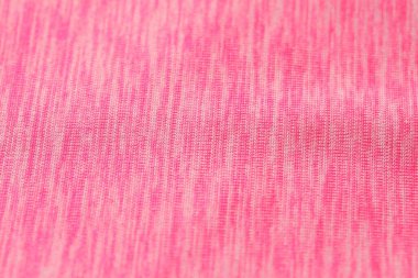 Arka plan olarak yumuşak pembe kumaşın dokusu, yakın plan