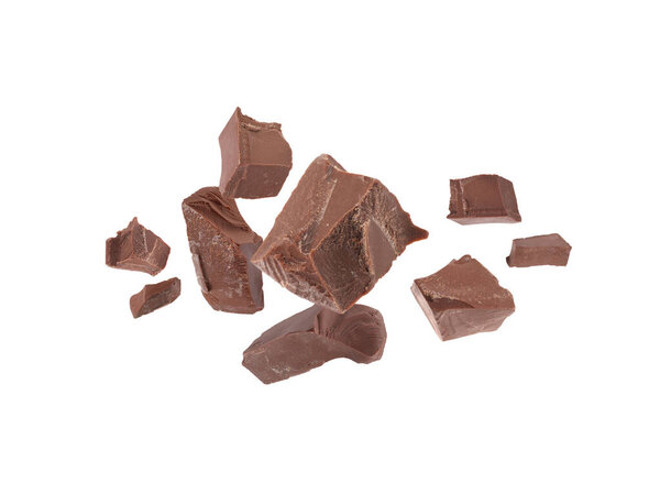 Tasty chocolate chunks falling on white background