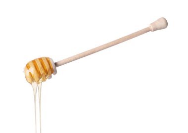 Beyaz arka planda Dipper 'dan damlayan taze bal