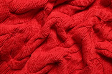 Arka plan olarak yumuşak kırmızı örülmüş kumaş dokusu, üst görünüm