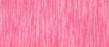 Arka plan olarak yumuşak pembe kumaşın dokusu, üst görünüm