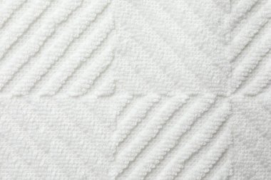 Arkaplan olarak beyaz kumaşın dokusu, üst görünüm