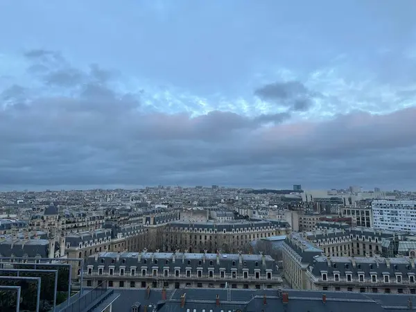 Beautiful buildings in Paris on cloudy day, view from hotel window