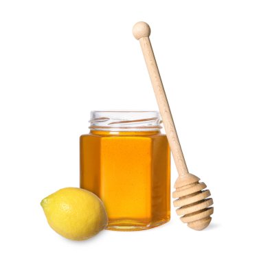 Bal cam kavanozda, limon ve balık beyazda izole edilmiş.