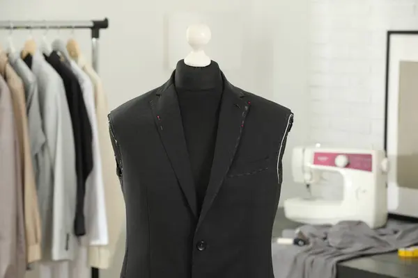 Mannequin with unfinished jacket in tailor shop