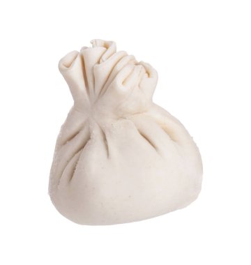 Beyaz üzerine pişmemiş khinkali (hamur tatlısı). Gürcistan mutfağı