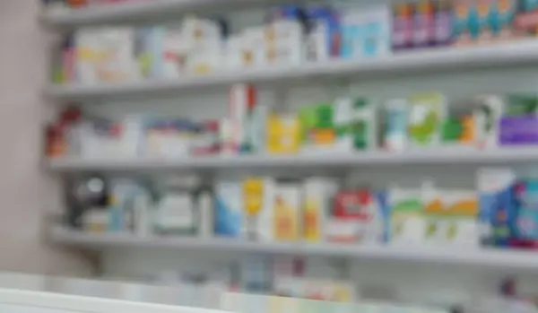Blurred view of modern pharmacy interior with different medicine
