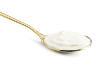 Bir altın kaşık ve beyaz mayonez.