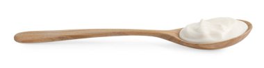 Beyaz üzerinde mayonez bulunan bir tahta kaşık.