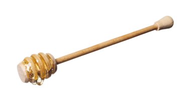 Beyaz arka planda doğal bal damlıyor.