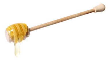 Beyaz arka planda doğal bal damlıyor.