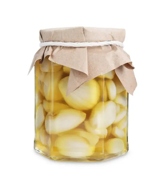 stock image Garlic with honey in glass jar isolated on white