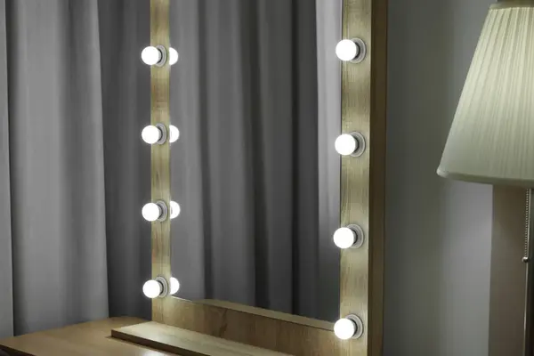Beautiful mirror with light bulbs in makeup room
