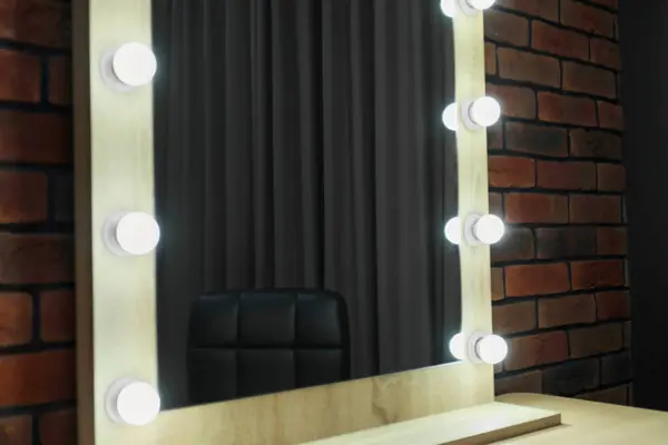 Mirror with light bulbs in makeup room