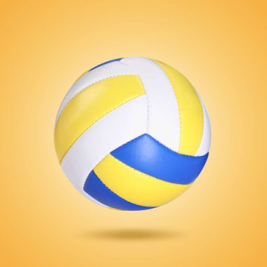 Turuncu arka planda havada bir voleybol topu
