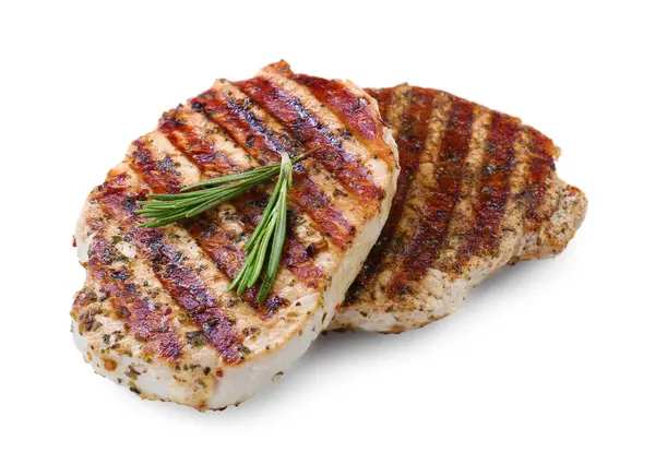 Lezzetli kızarmış domuz bifteği ve beyaz üzerine izole edilmiş biberiye.