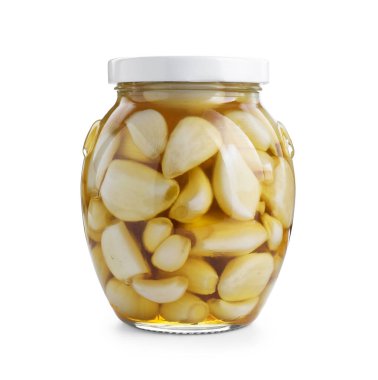 Bembeyaz kavanozda ballı sarımsak.