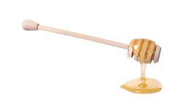 Beyaz arka planda doğal bal damlıyor.