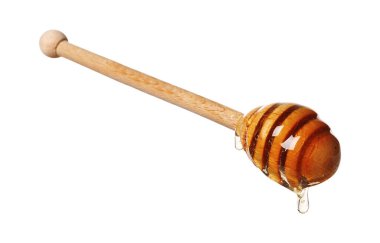 Beyaz arka planda doğal bal damlıyor.
