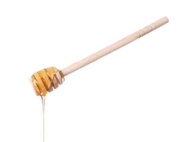 Beyaz arka planda Dipper 'dan damlayan taze bal