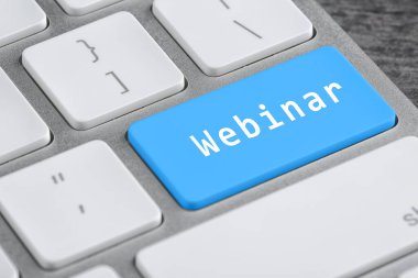 Klavyede Webinar kelimesi olan açık mavi düğme, kapat