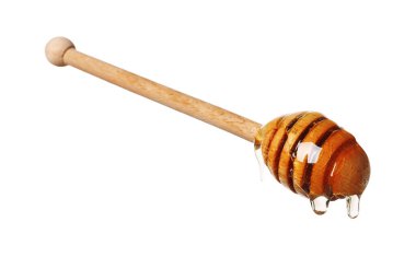 Beyaz arka planda doğal bal damlıyor.