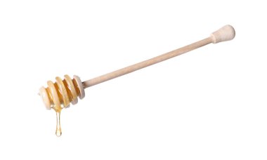 Beyaz arka planda Dipper 'dan damlayan taze bal