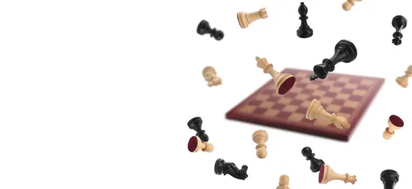 Chess pieces and wooden checkerboard falling on white background