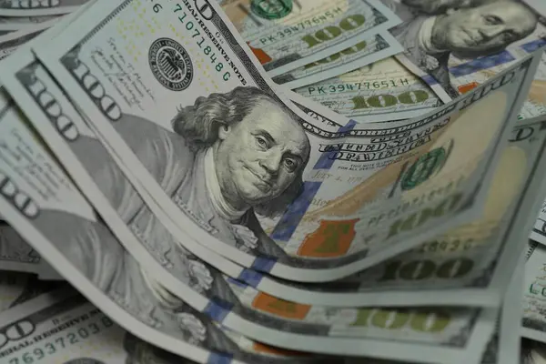 Money exchange. Dollar banknotes as background, closeup