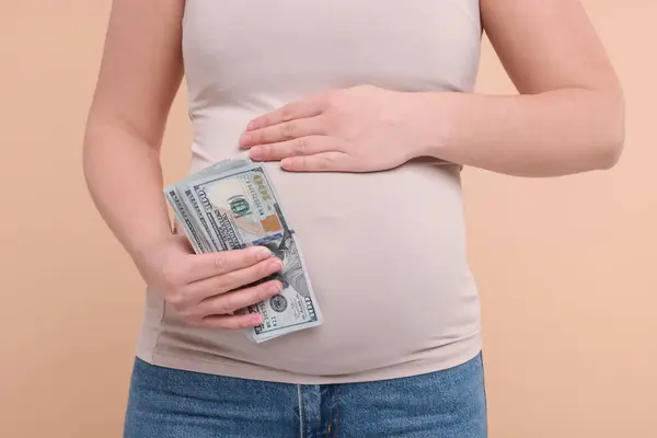 Surrogate Mother Pregnant Woman Dollar Banknotes Beige Background Closeup — Stock Photo, Image