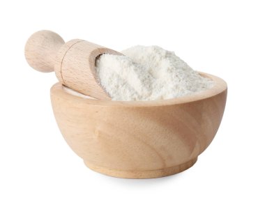 Kabın içindeki kabartma tozu ve beyazın üzerindeki kepçe.