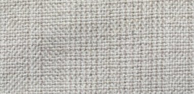 Arka plan olarak yumuşak açık gri kumaşın dokusu, üst görünüm