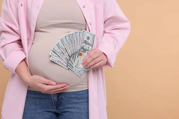 Surrogate Mother Pregnant Woman Dollar Banknotes Beige Background Closeup Space — Stock Photo, Image