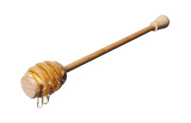 Beyaz arka planda doğal bal damlıyor.