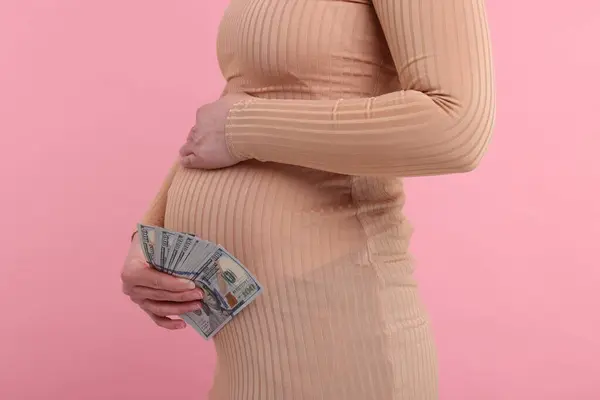 Surrogate Mother Pregnant Woman Dollar Banknotes Pink Background Closeup — Stock Photo, Image
