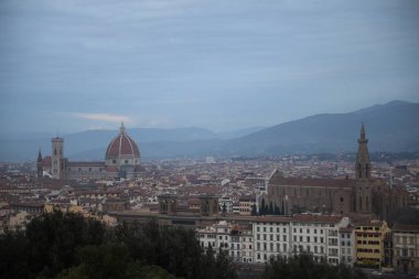 Florence, Italy - February 8, 2024: Picturesque view of city with beautiful buildings and mointains clipart