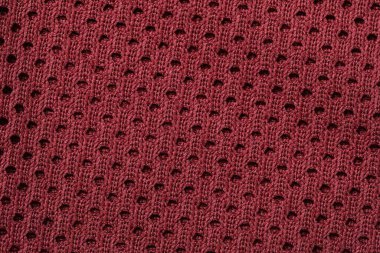 Arka plan olarak bordo örülmüş kumaş dokusu, üst görünüm