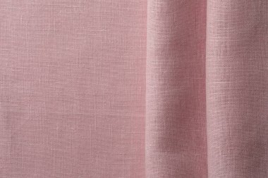 Arka plan olarak pembe kumaşın dokusu, üst görünüm