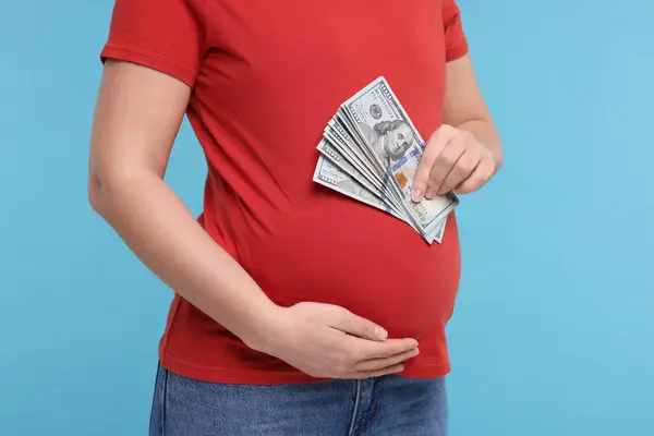 Surrogate Mother Pregnant Woman Dollar Banknotes Light Blue Background Closeup — Stock Photo, Image