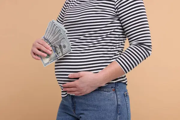 Surrogate Mother Pregnant Woman Dollar Banknotes Beige Background Closeup — Stock Photo, Image